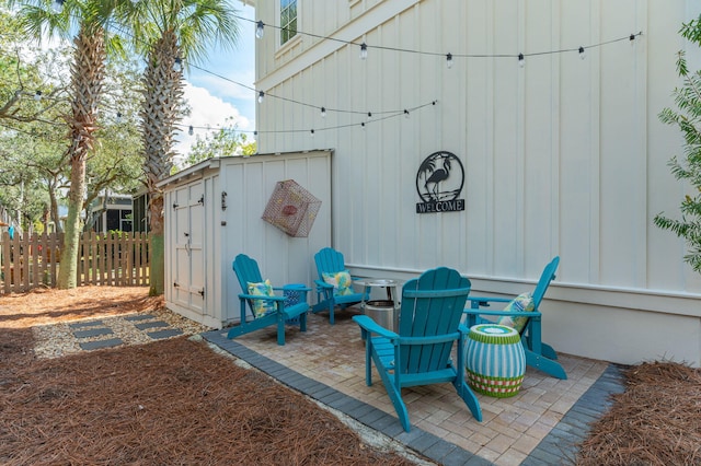 view of patio featuring a storage unit