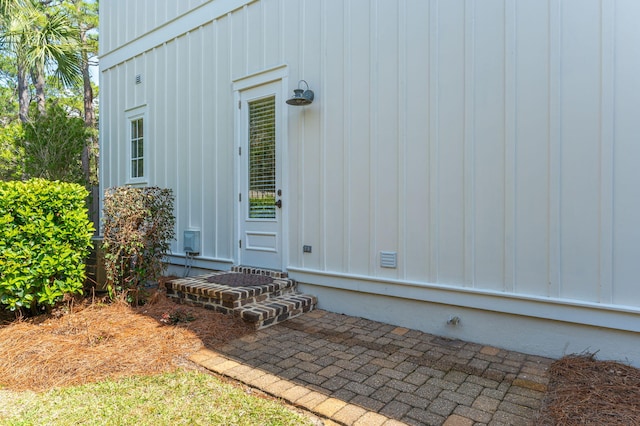 entrance to property with a patio