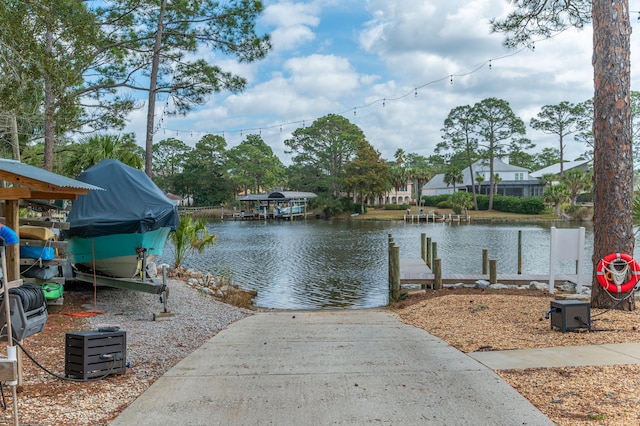 property view of water with a dock