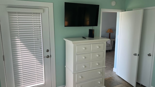 interior details featuring tile flooring and vanity