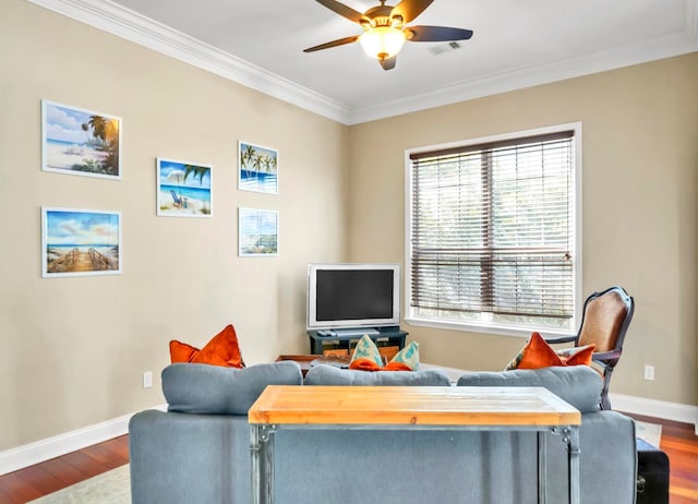 living room with ceiling fan, crown molding, and dark wood-type flooring