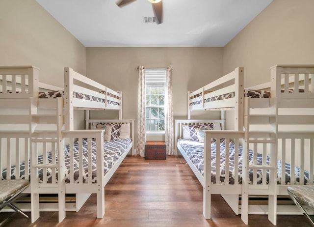 bedroom featuring ceiling fan and dark hardwood / wood-style floors