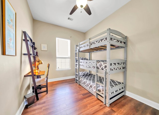 bedroom featuring dark hardwood / wood-style flooring and ceiling fan