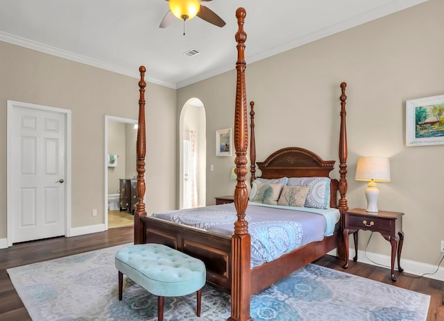 bedroom with crown molding, dark hardwood / wood-style flooring, and ceiling fan