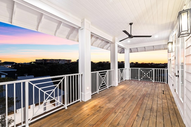 deck at dusk with ceiling fan