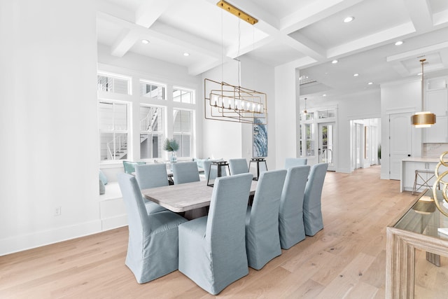 dining area with beam ceiling, light hardwood / wood-style floors, and coffered ceiling