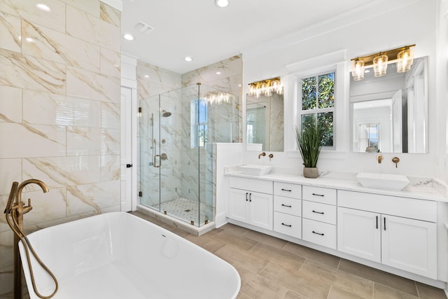 bathroom featuring double vanity, tile flooring, and plus walk in shower