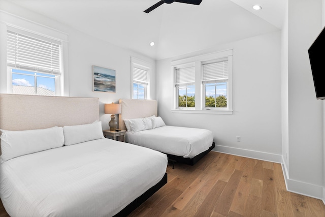 bedroom with ceiling fan and light wood-type flooring