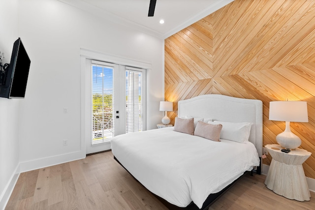 bedroom featuring french doors, ceiling fan, access to outside, light wood-type flooring, and ornamental molding