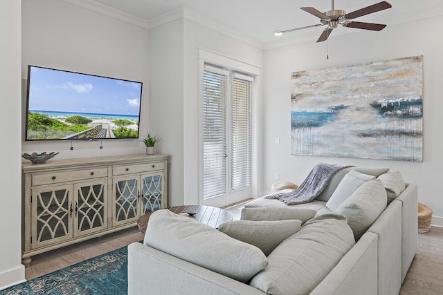 living room with ceiling fan, light hardwood / wood-style floors, and ornamental molding