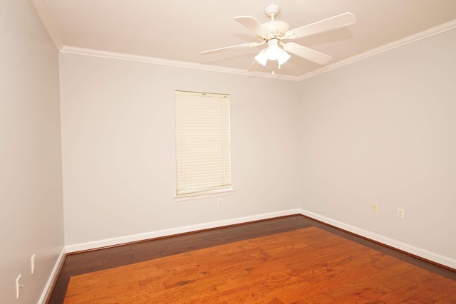 spare room featuring crown molding, hardwood / wood-style floors, and ceiling fan