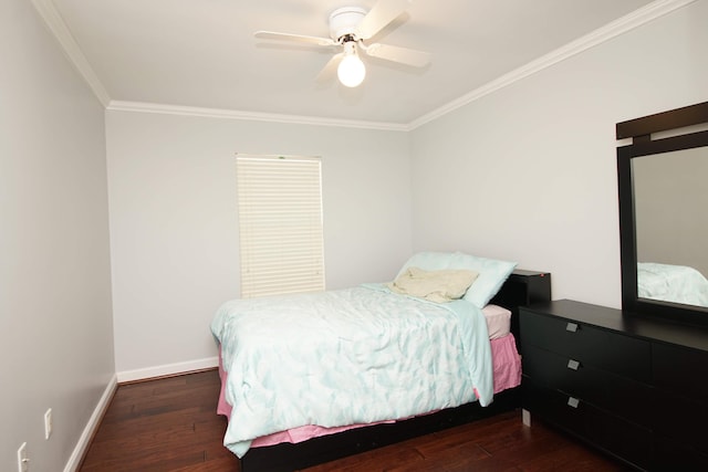 bedroom featuring ceiling fan, crown molding, and dark wood-type flooring