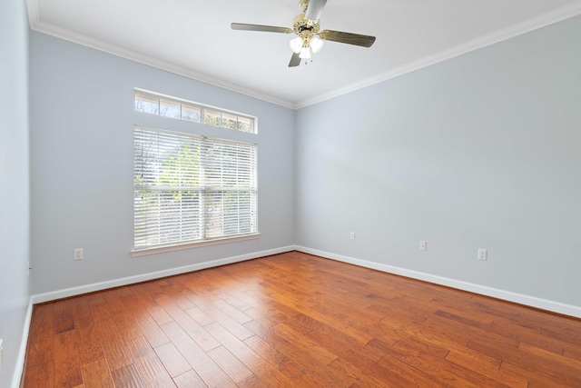 unfurnished room with hardwood / wood-style flooring, ornamental molding, and ceiling fan