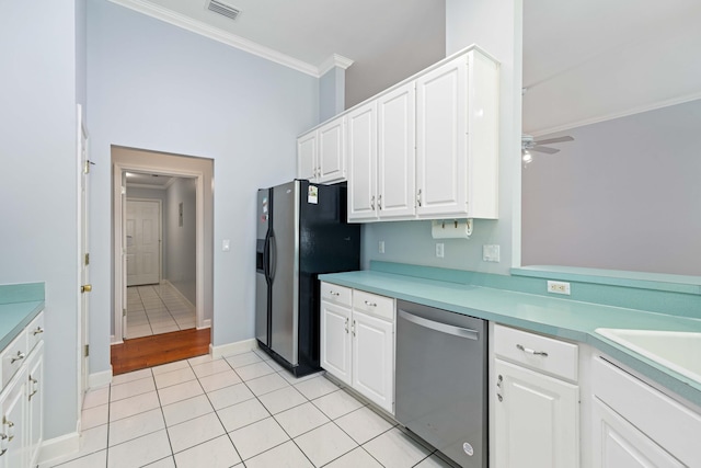 kitchen featuring white cabinetry, light tile patterned floors, crown molding, and stainless steel appliances