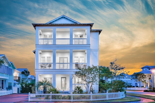 view of front of home featuring a balcony