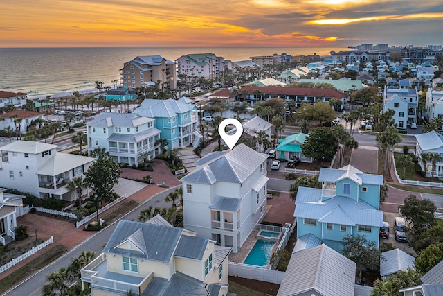 aerial view at dusk with a water view