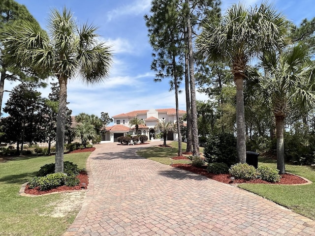 view of home's community featuring a lawn