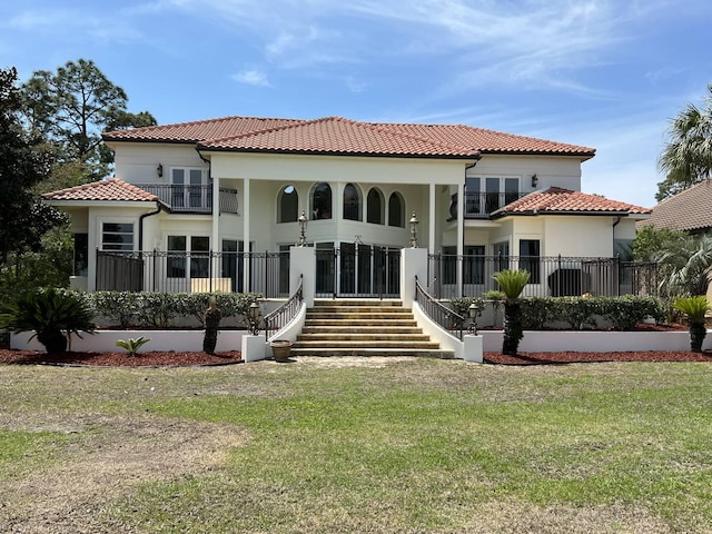 rear view of house with a yard