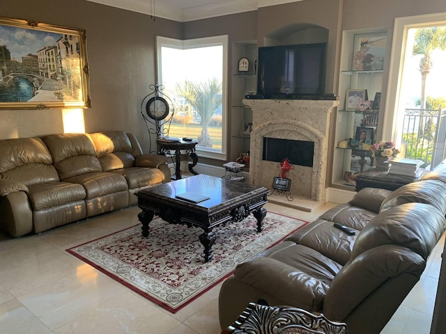 living room featuring crown molding and a fireplace