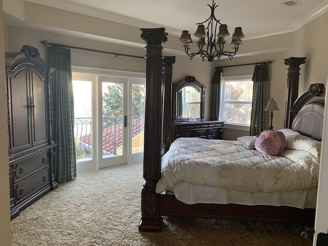 carpeted bedroom with access to exterior, crown molding, multiple windows, and an inviting chandelier