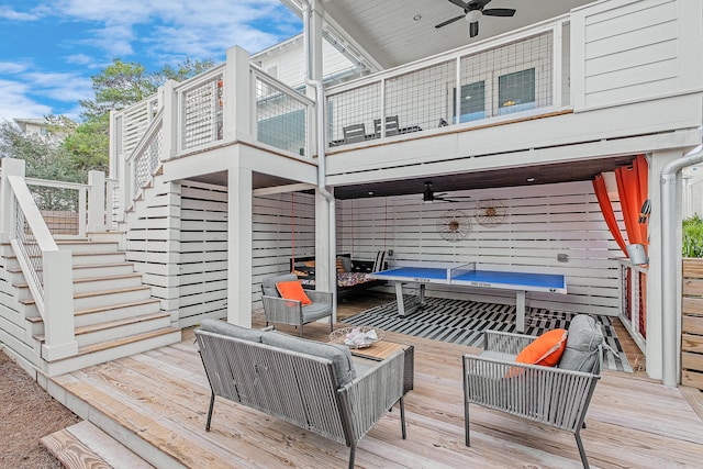 deck featuring ceiling fan and outdoor lounge area