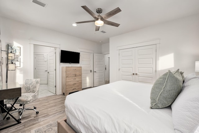 bedroom featuring light hardwood / wood-style flooring and ceiling fan