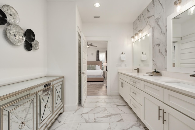 bathroom featuring ceiling fan, tile floors, and double vanity