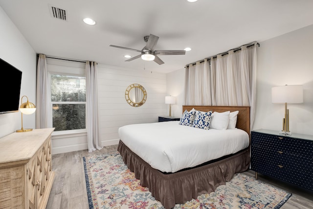 bedroom featuring light hardwood / wood-style floors and ceiling fan