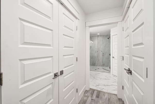 hall with light tile flooring