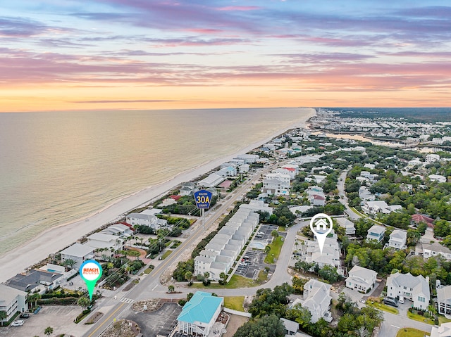 aerial view at dusk with a water view