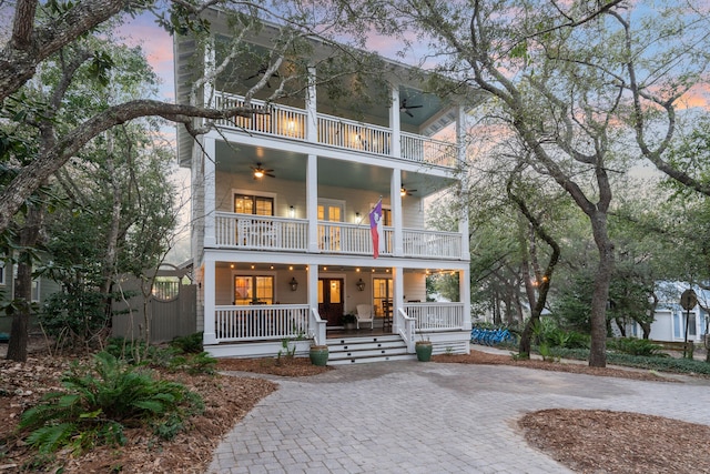 view of front of property with a balcony and covered porch