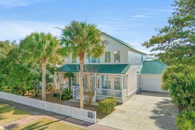 view of front of home featuring a garage and a porch