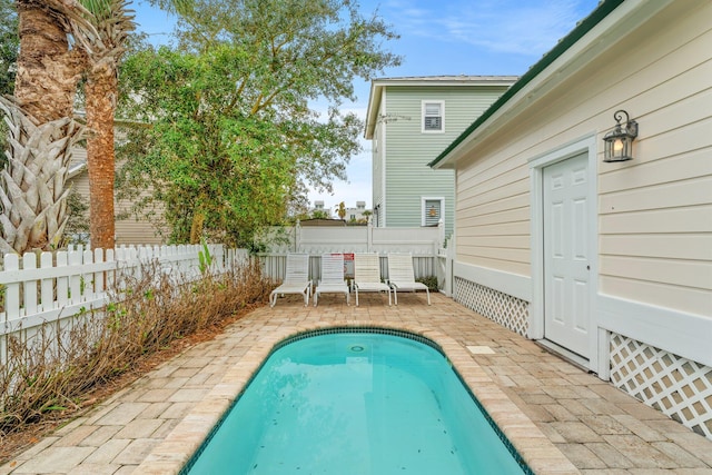 view of swimming pool with a patio