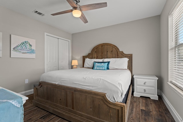 bedroom featuring a closet, ceiling fan, and dark wood-type flooring