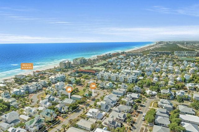 bird's eye view with a water view and a view of the beach