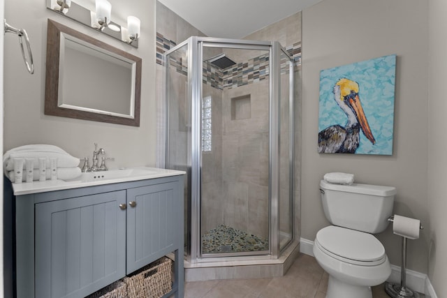 bathroom with a shower with shower door, toilet, oversized vanity, and tile flooring