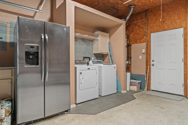 laundry area featuring hookup for a washing machine, washing machine and dryer, and cabinets