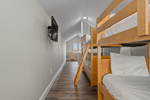 bedroom featuring lofted ceiling and dark hardwood / wood-style flooring