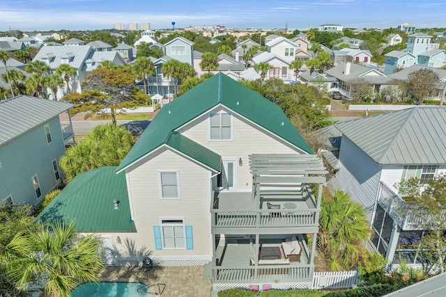 rear view of property with a balcony