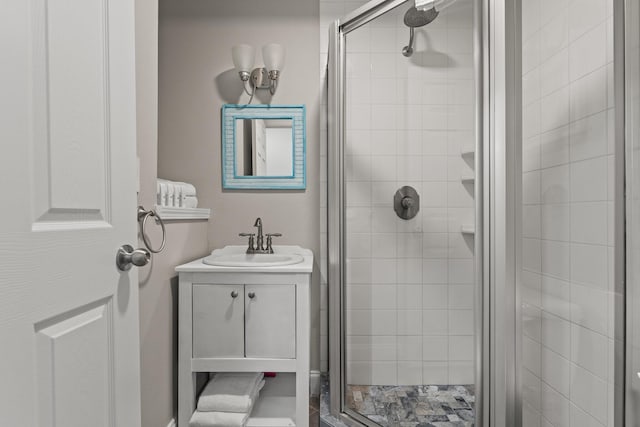 bathroom featuring walk in shower and vanity