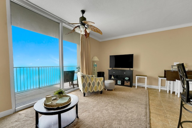 living room featuring crown molding, ceiling fan, and light tile floors