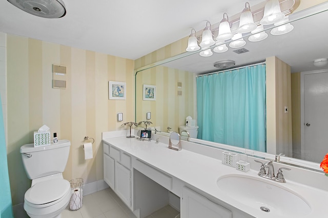 bathroom featuring wallpapered walls, baseboards, toilet, tile patterned floors, and vanity