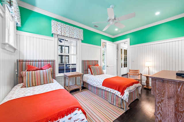 bedroom featuring ornamental molding, ceiling fan, multiple windows, and dark wood-type flooring