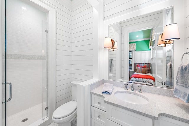 bathroom featuring walk in shower, vanity, toilet, and ornamental molding