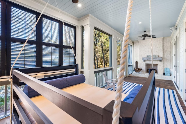 wooden terrace featuring ceiling fan