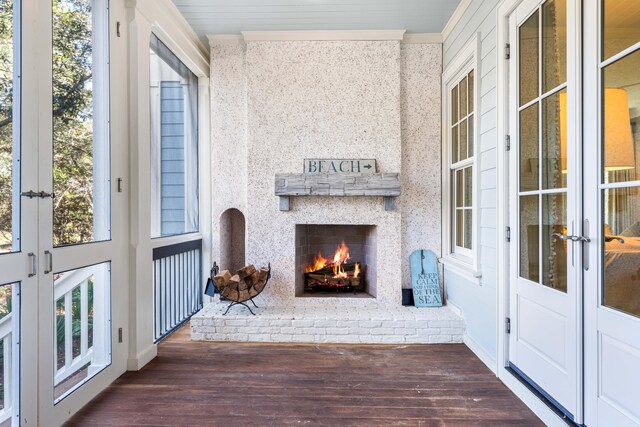 exterior space with french doors and a brick fireplace