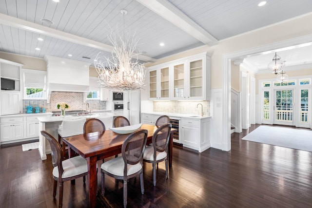 dining area with beverage cooler, dark hardwood / wood-style floors, beamed ceiling, sink, and a notable chandelier