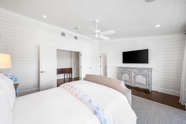 bedroom featuring vaulted ceiling, ceiling fan, a closet, and dark hardwood / wood-style floors