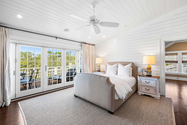 bedroom featuring ceiling fan, dark hardwood / wood-style flooring, lofted ceiling, and access to exterior