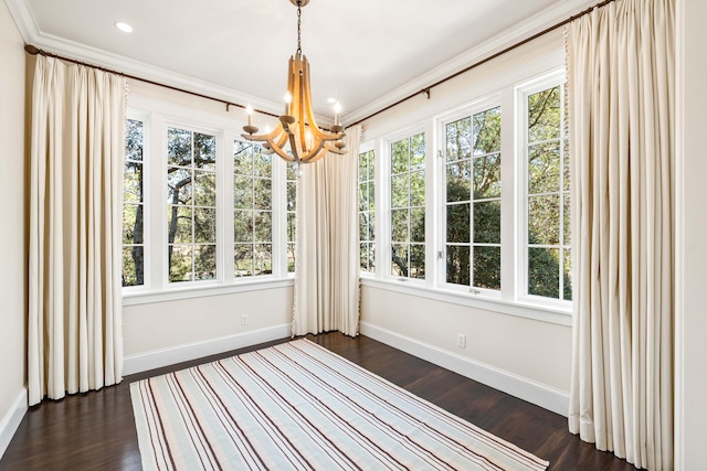 unfurnished sunroom with plenty of natural light and an inviting chandelier